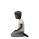 pessoa ajoelhando: pele escura